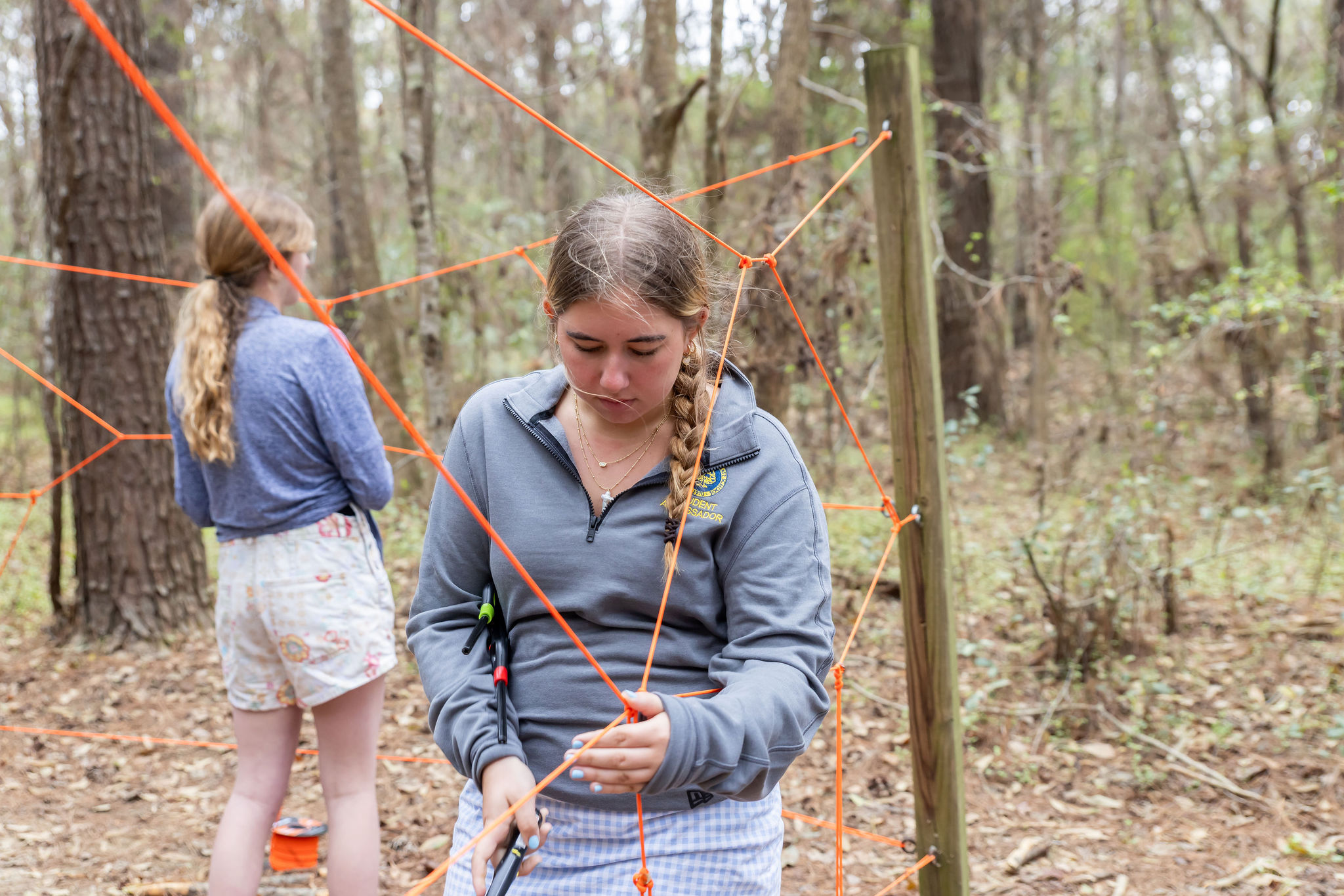 Students learning knots in wilderness survival. 