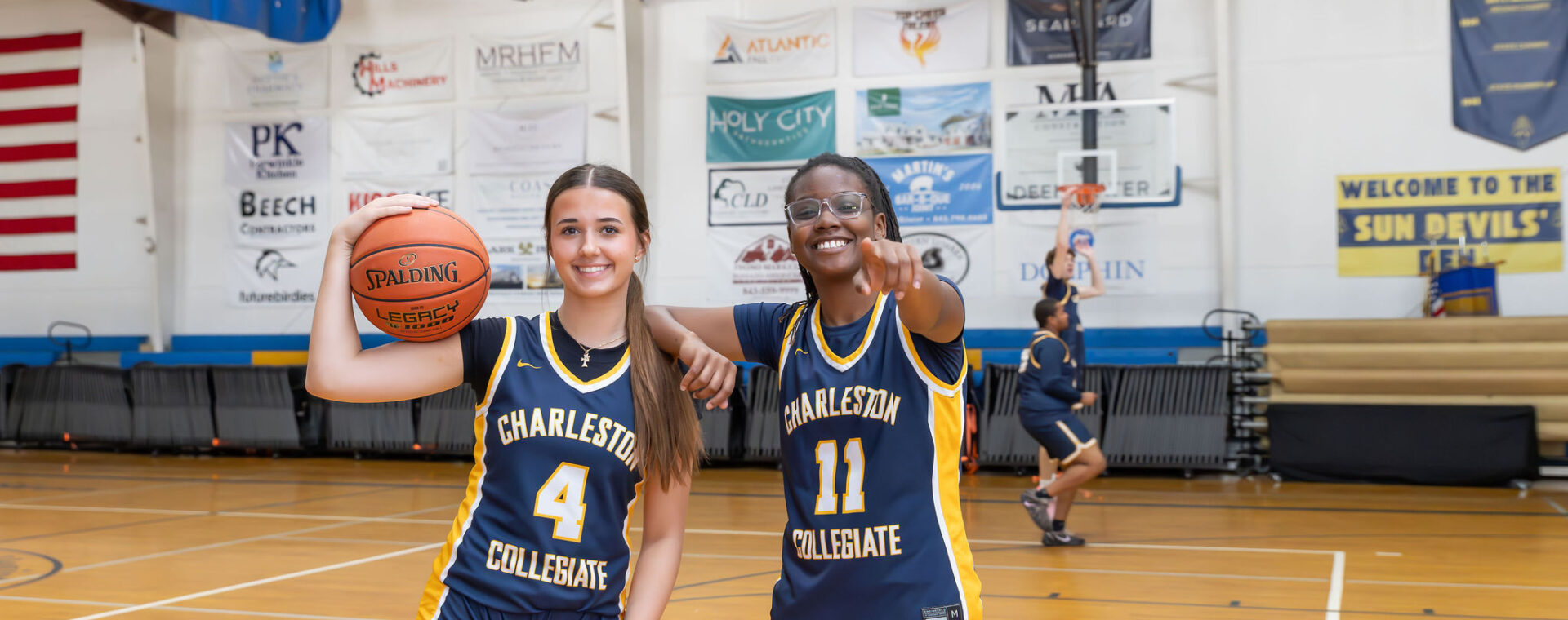 Charleston Collegiate Varsity girls basketball players pose for a photo.