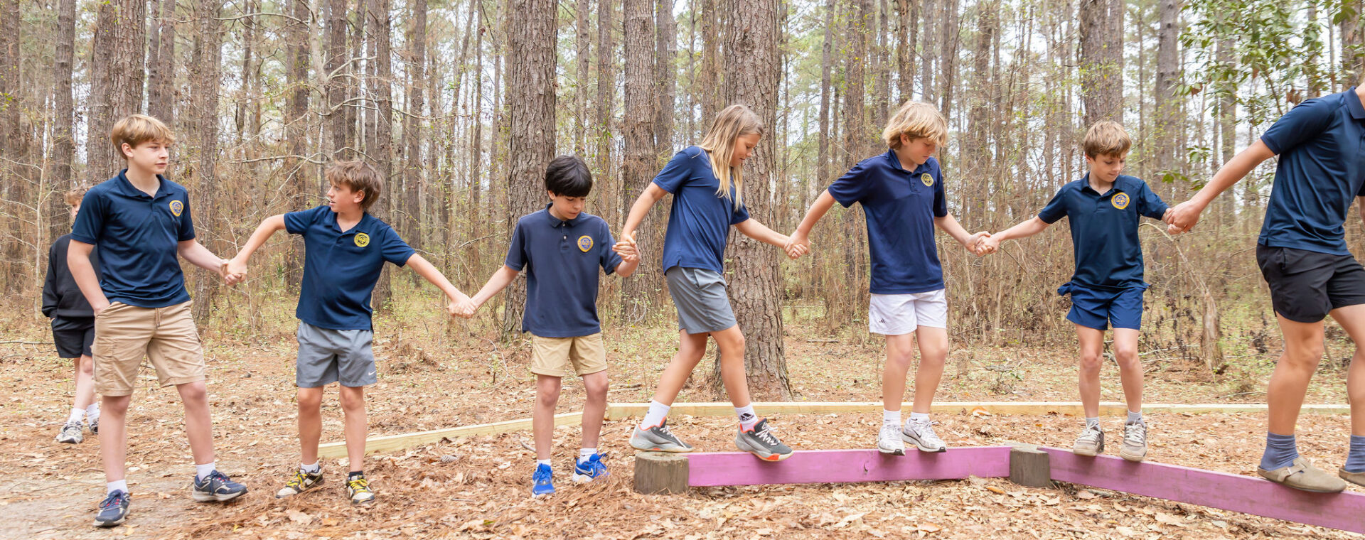 Students on team building elements in the outdoor education center. 