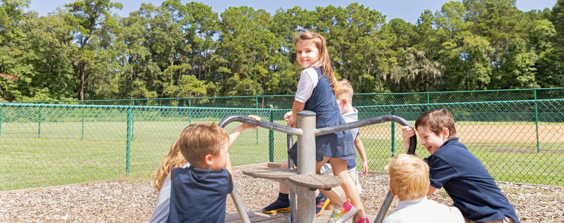 Lower school students playing on the playground.