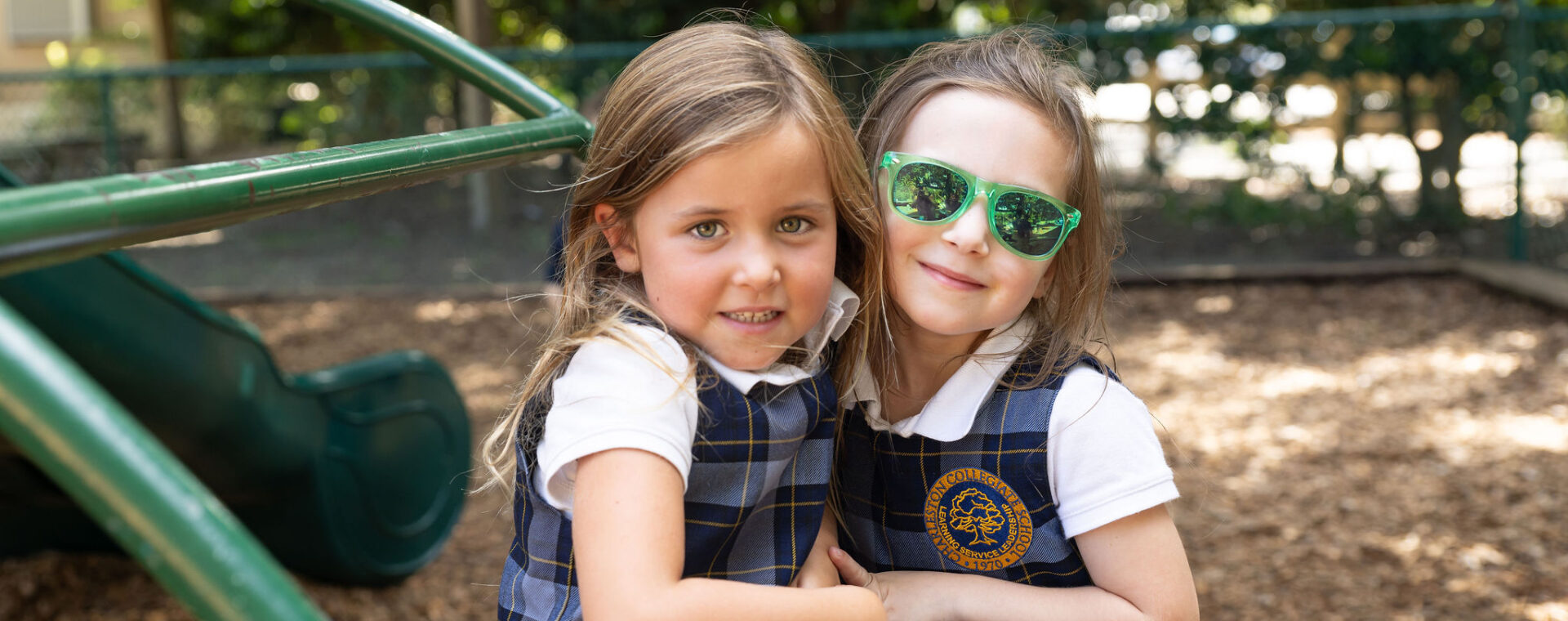 Students hanging out on the playground. 