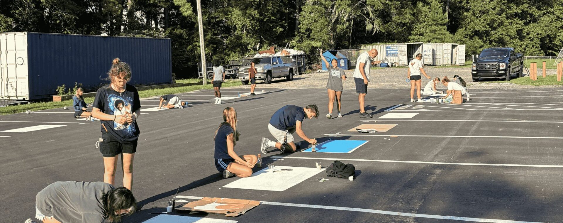Seniors painting parking spots.