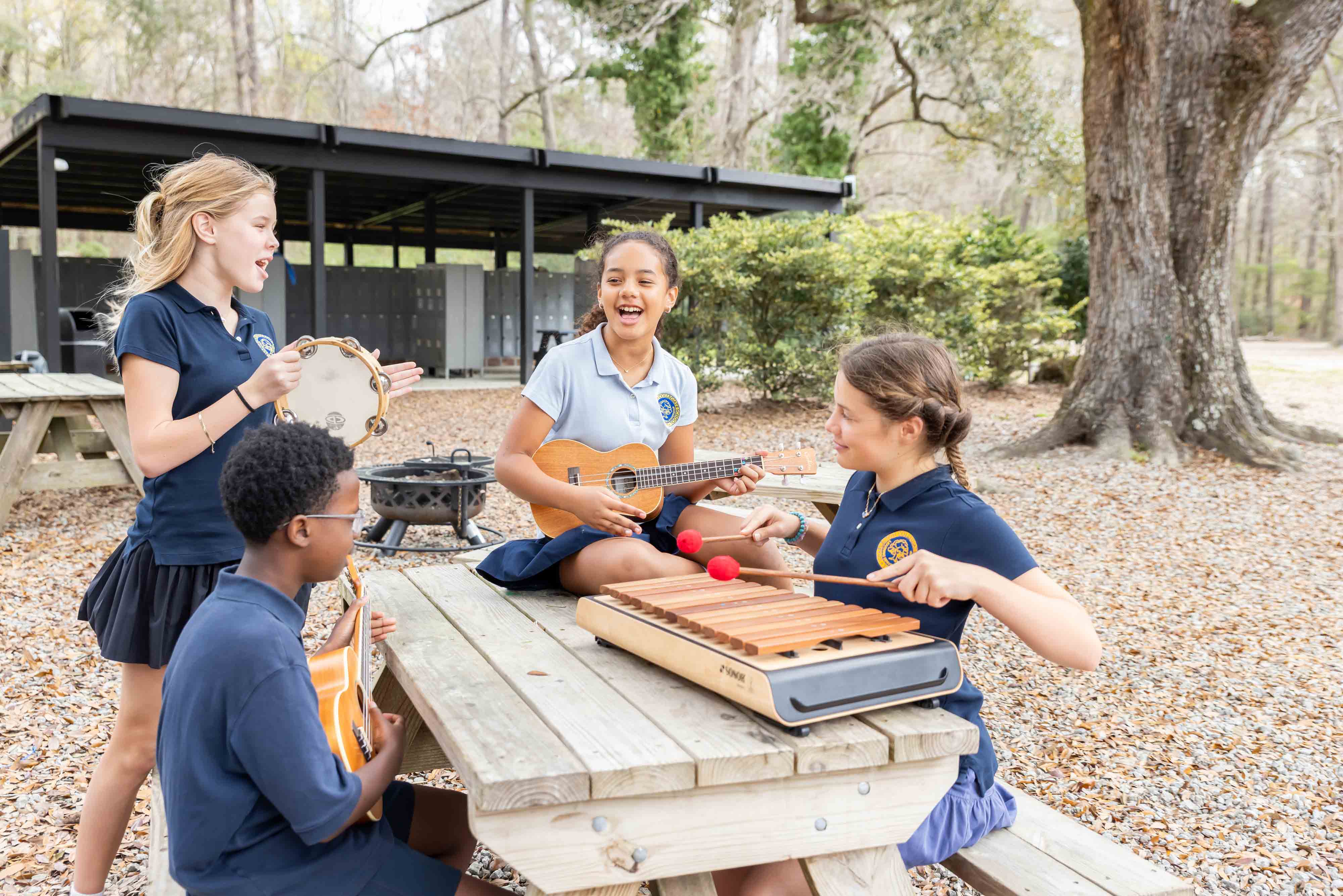 Students playing instruments outside. 