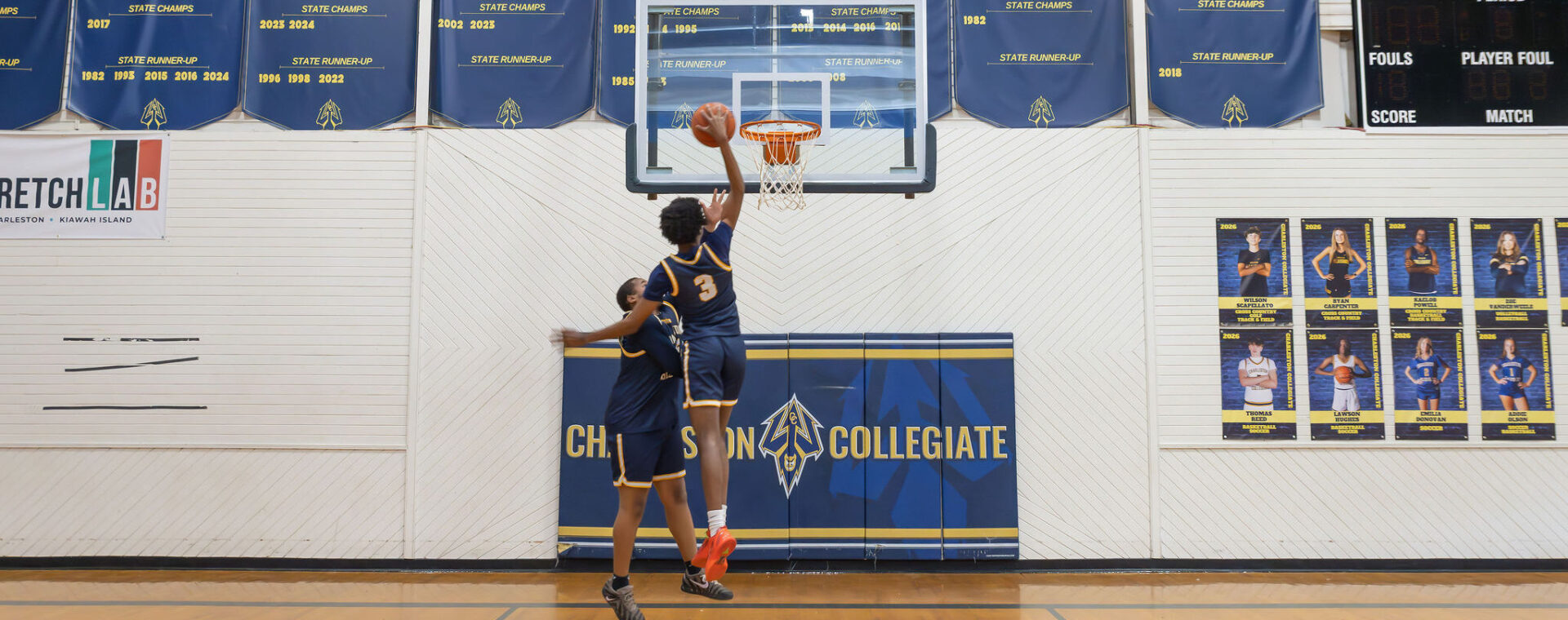 students playing basketball.