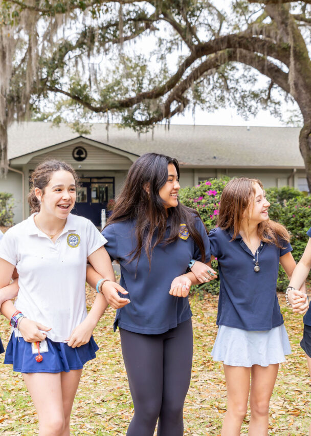 Middle schoolers walking through campus. 