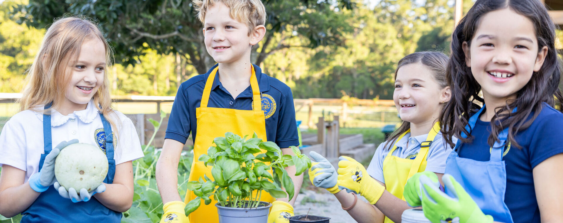 Lower School students in the garden presenting a project. 
