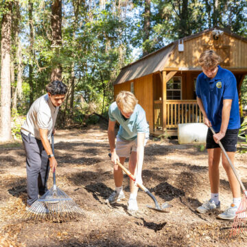 Upper school students outside in the outdoor education center. 