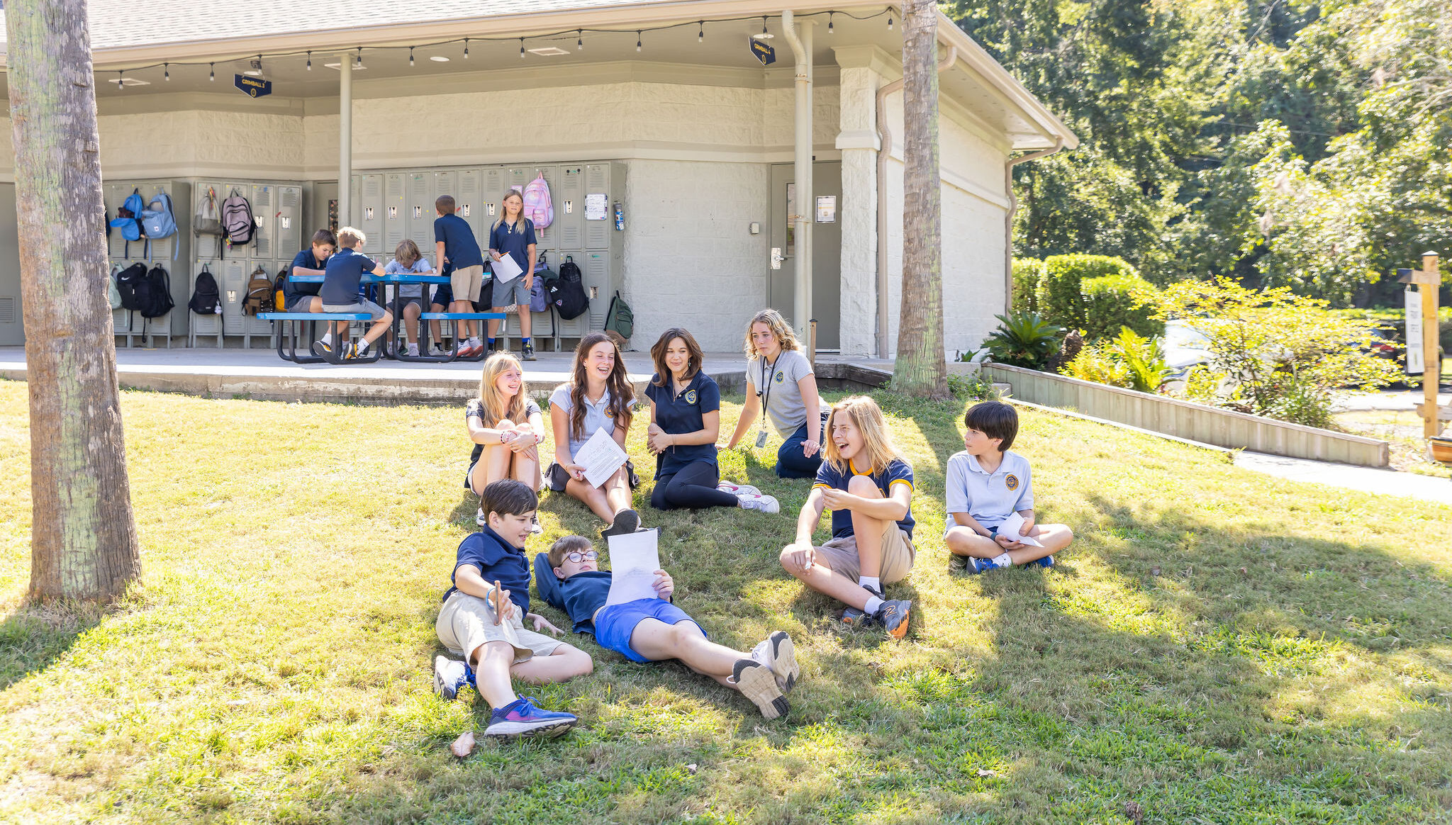 Students take their creative writing exercise outside.