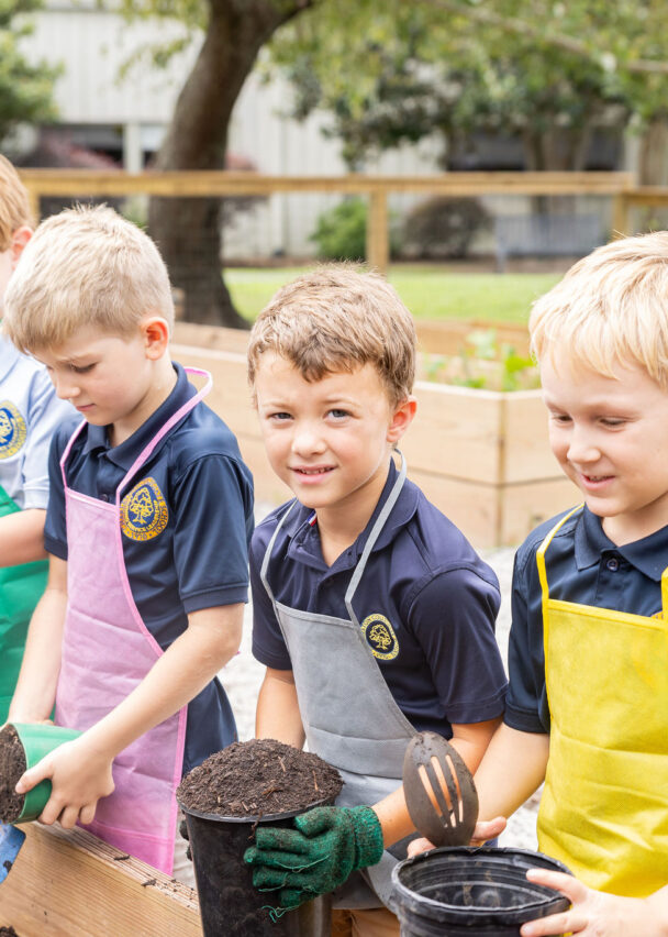 Students planting seeds in the outdoor garden and classroom.