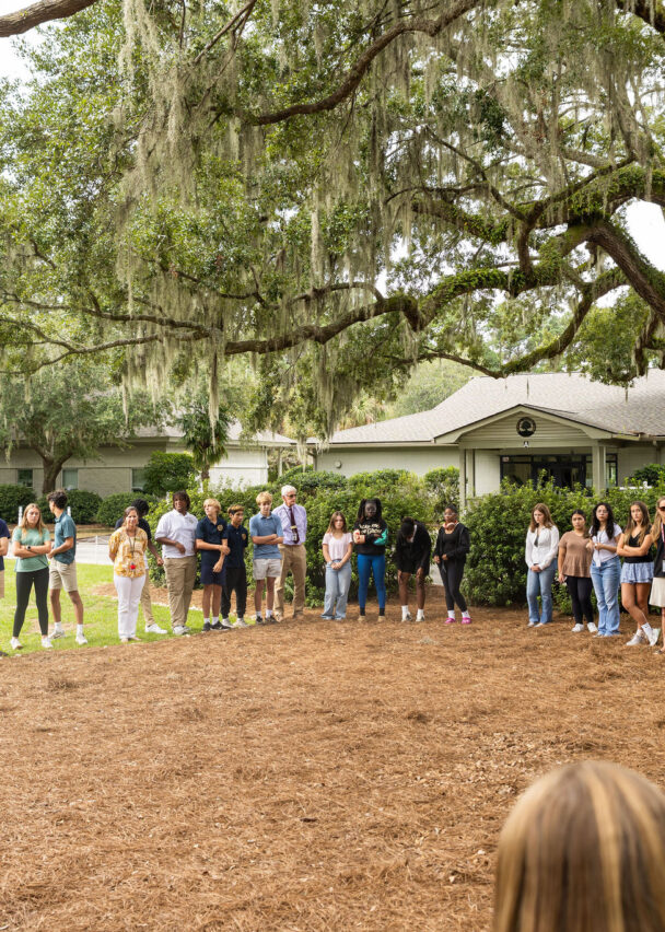 Students gather in a circle for assembly.
