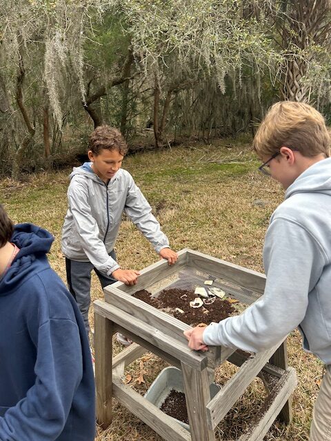 Students during an archeological dig. 