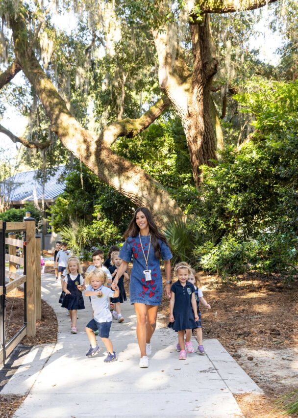 preschoolers walking through campus.